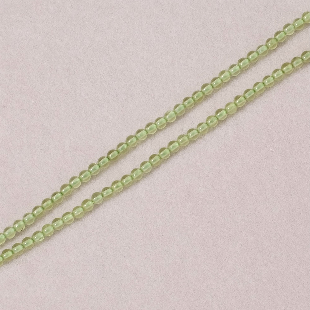 Strand of natural round 3mm beads in Peridot