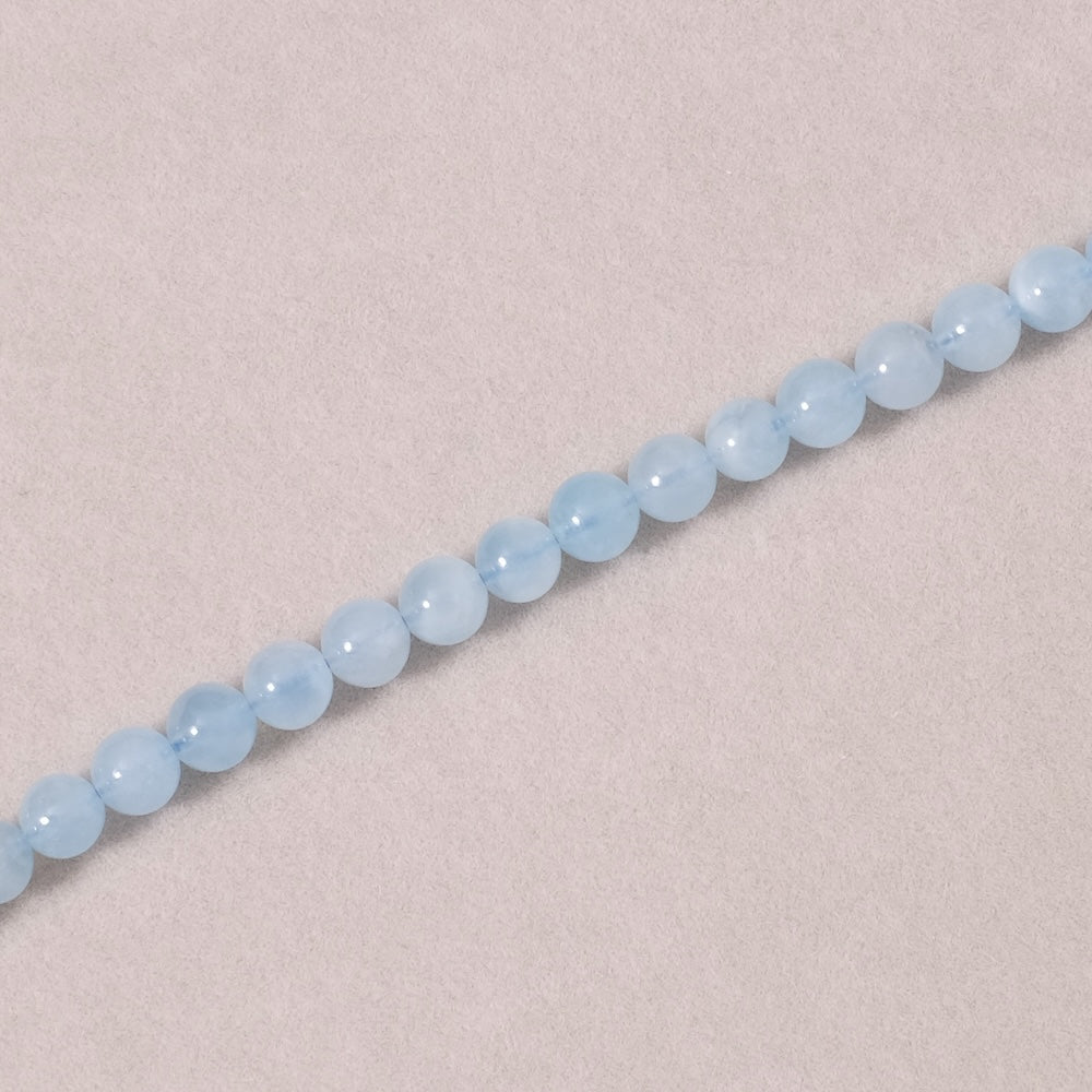 Strand of natural round 6mm beads in Aquamarine
