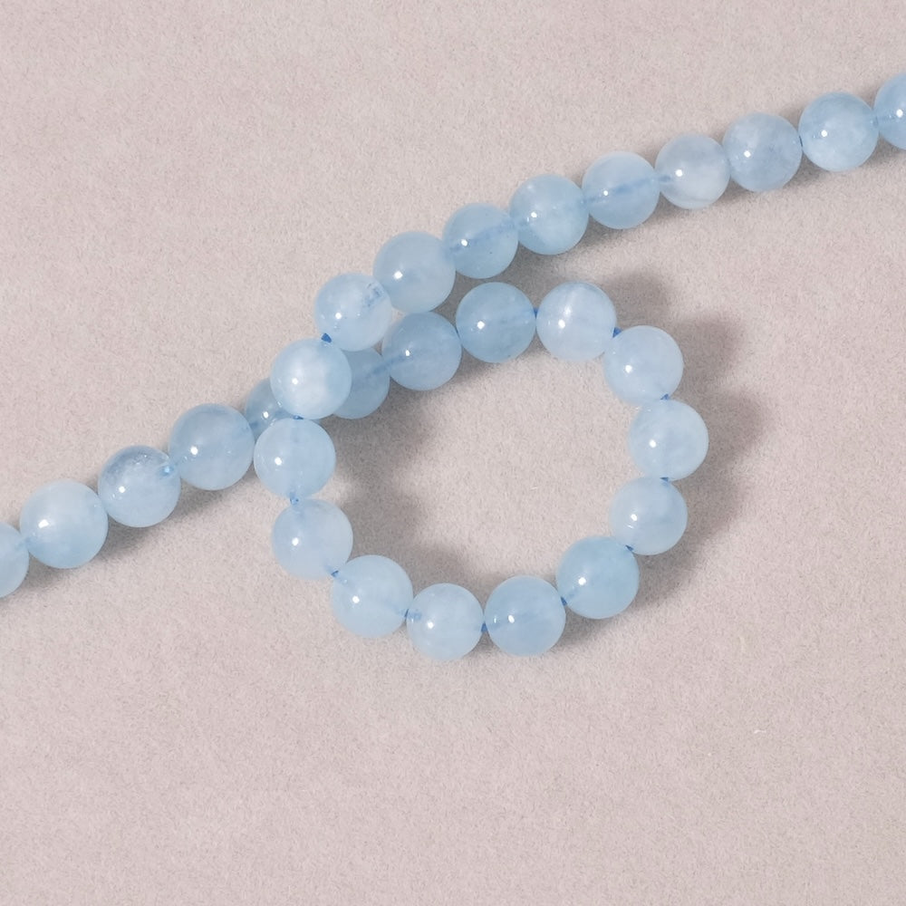 Strand of natural round 6mm beads in Aquamarine