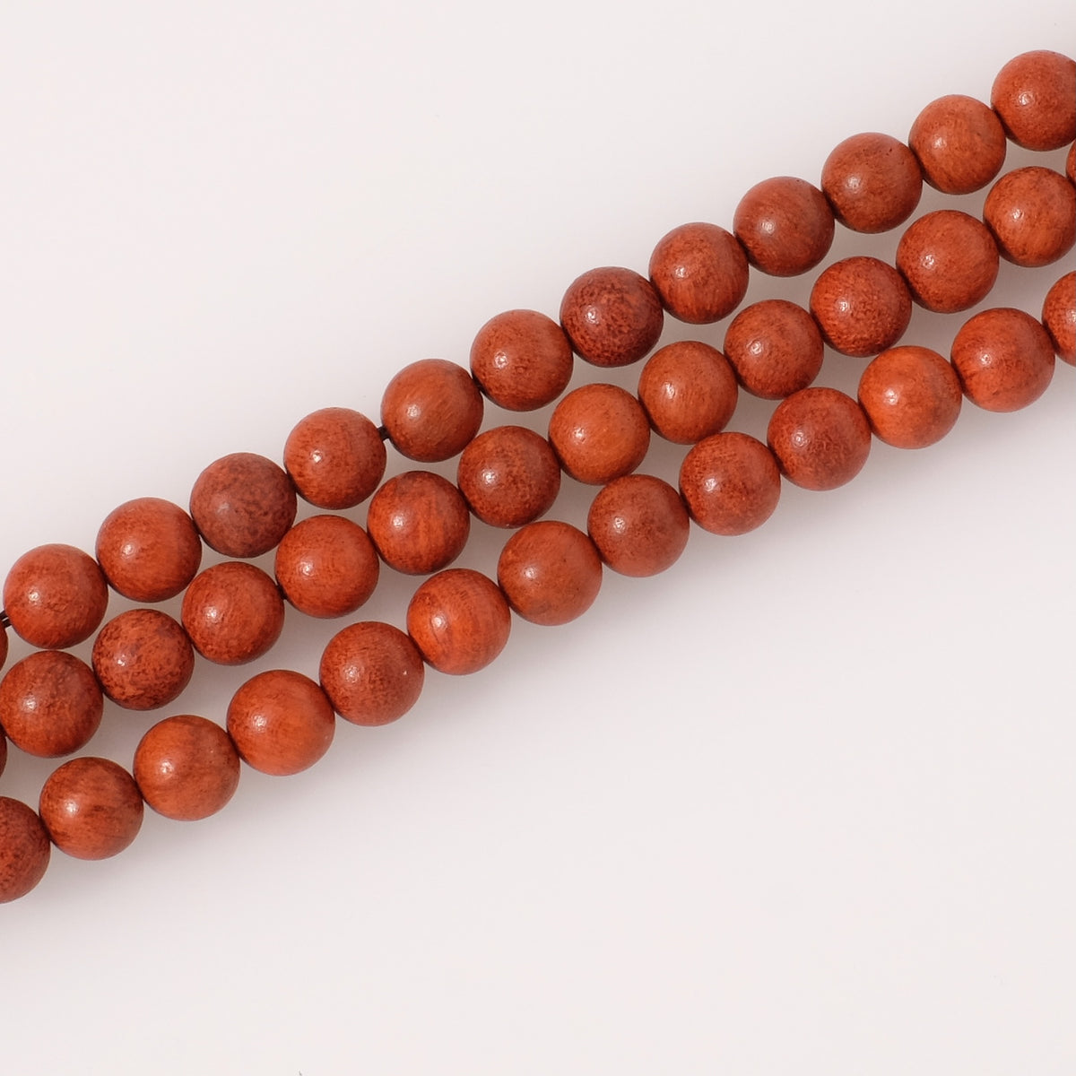 Strand of 8mm round wood beads, red orange