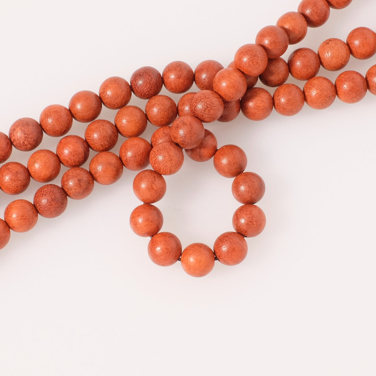 Strand of 8mm round wood beads, red orange