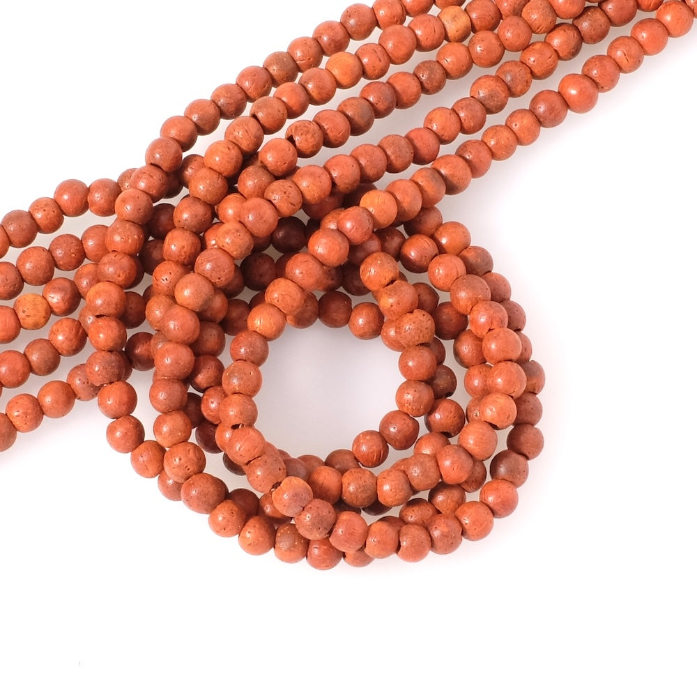 Strand of 4mm round wood beads, red orange