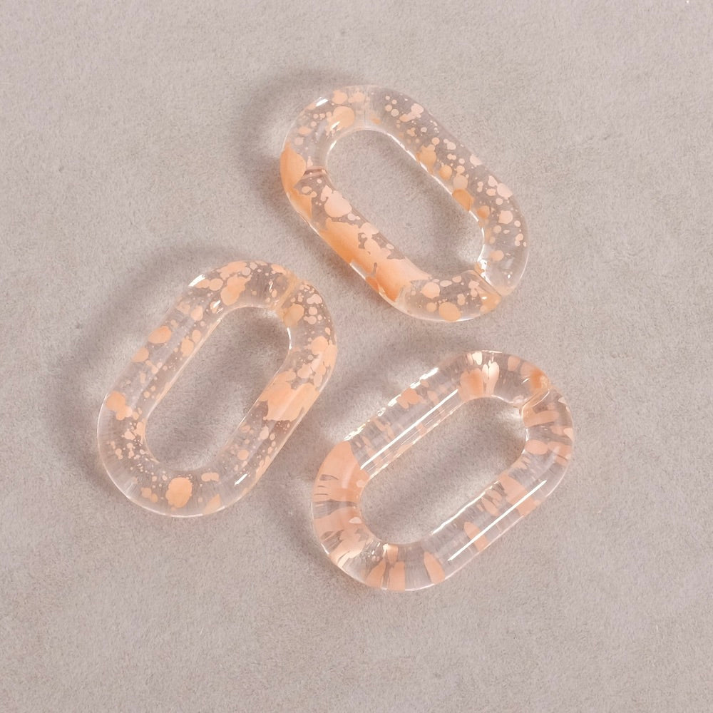 4 oval links 27mm in transparent pink speckled acetate