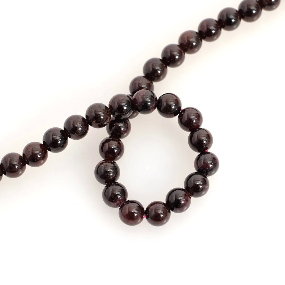 Strand of natural 7mm round garnet beads