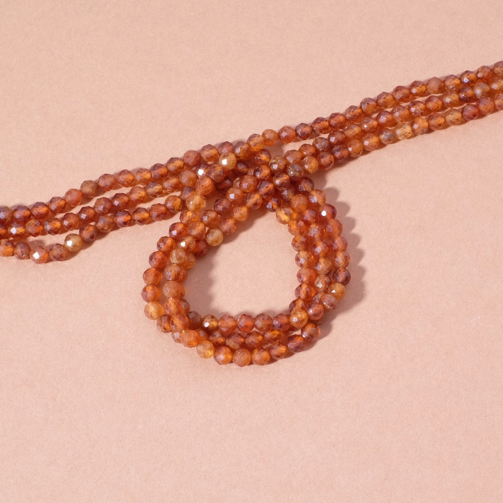 Strand of 4mm faceted garnet hessonite beads