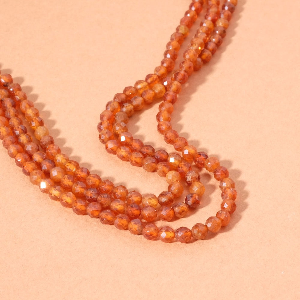 Strand of 4mm faceted garnet hessonite beads