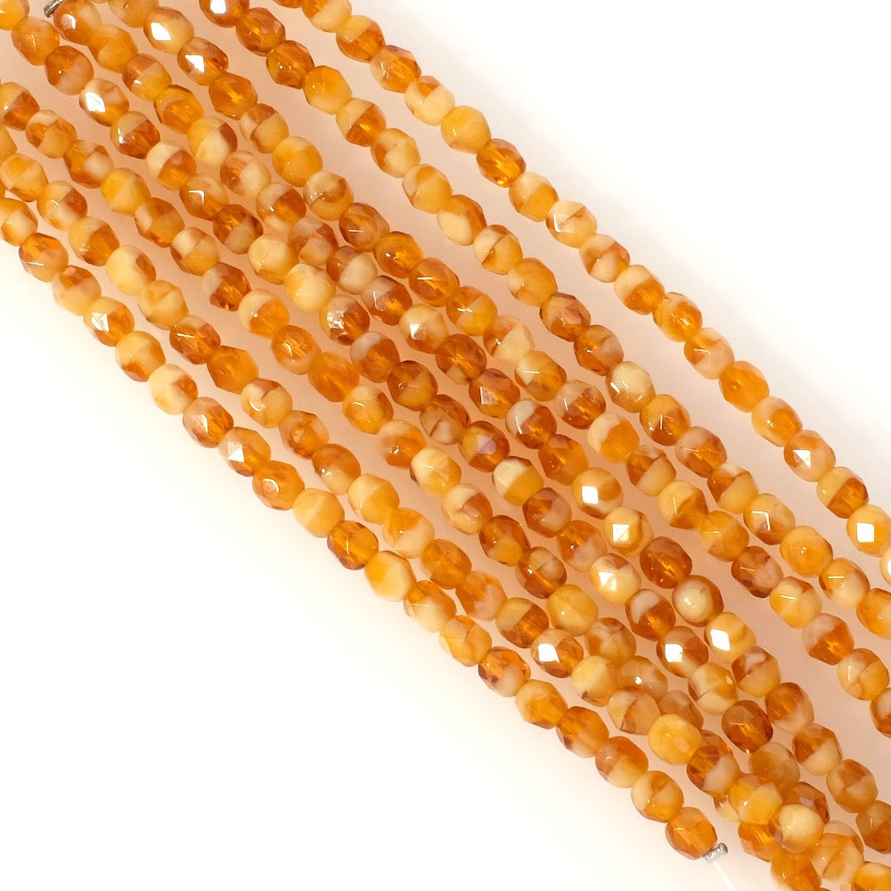 Strand of round faceted Bohemian beads 4mm honey orange