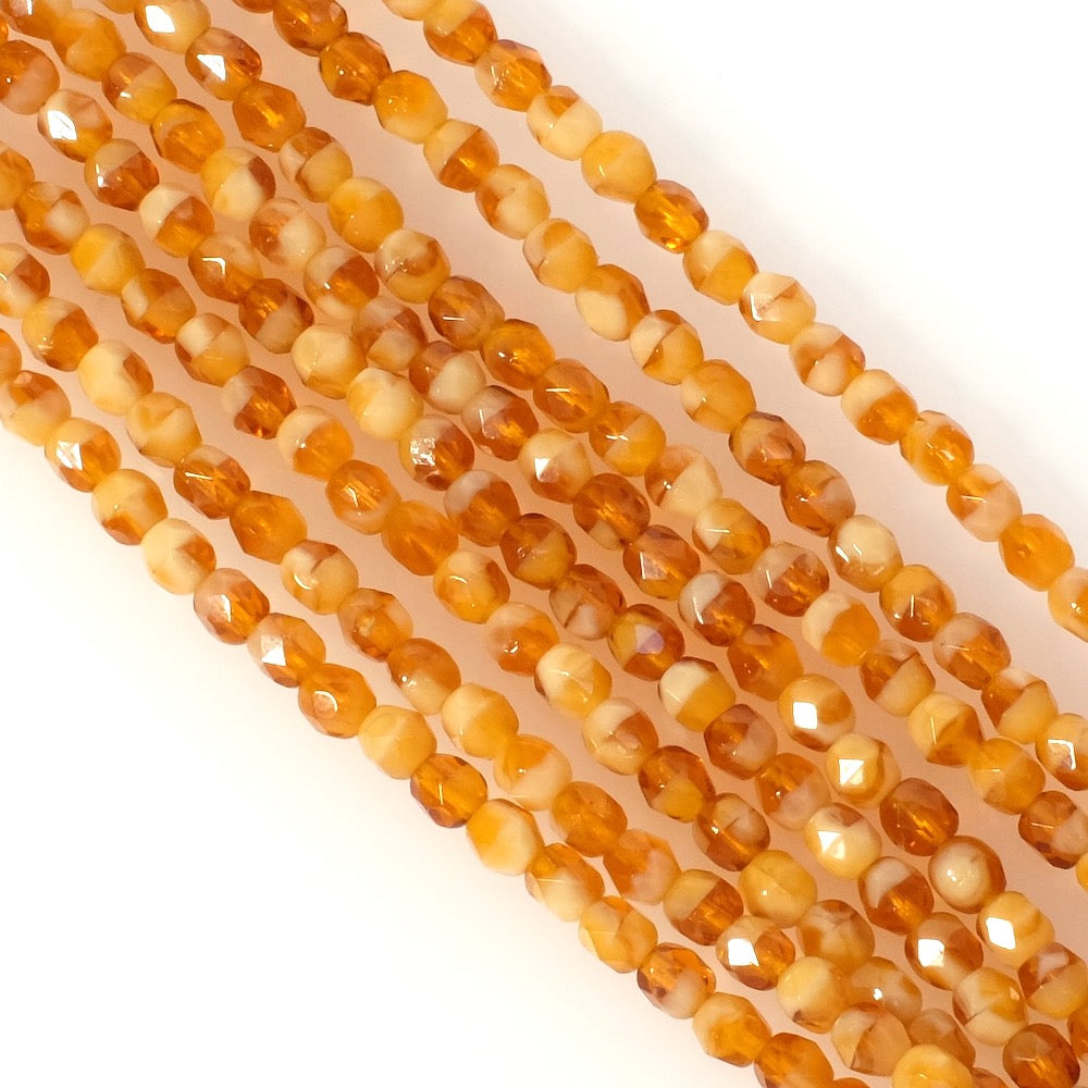 Strand of round faceted Bohemian beads 4mm honey orange