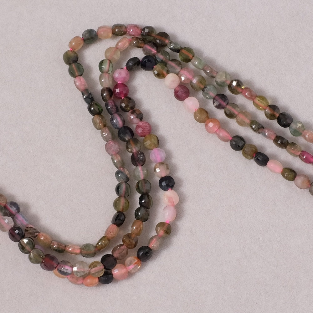 Strand of natural round flattened faceted 4mm Tourmaline beads