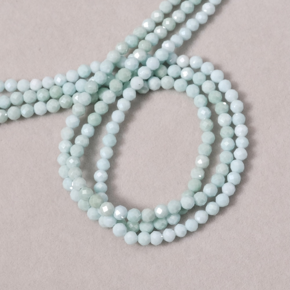 Strand of 3.4mm faceted round beads in Pastel Green Zirconium Oxide or Cubic Zirconia