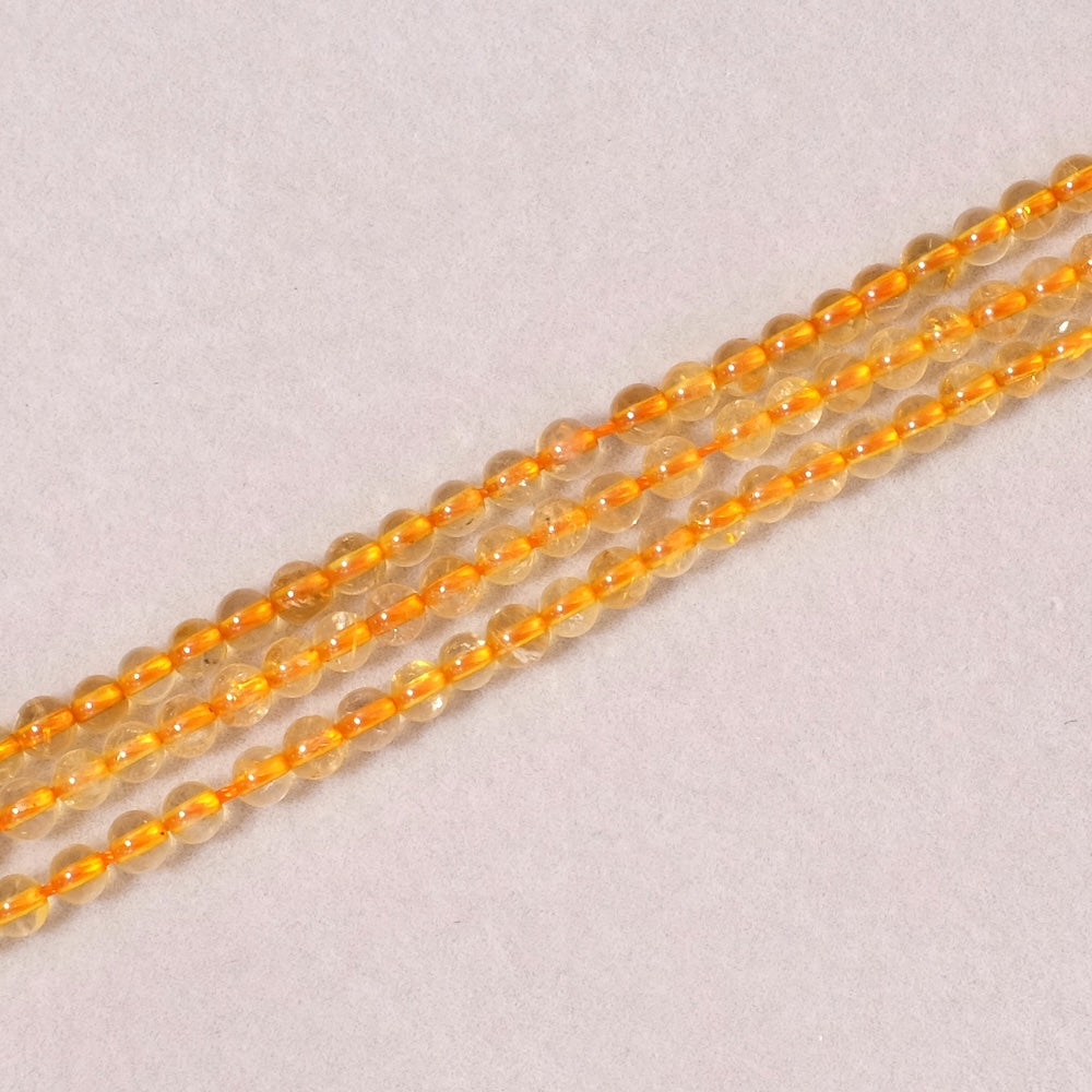 Strand of 4mm round beads in natural Citrine