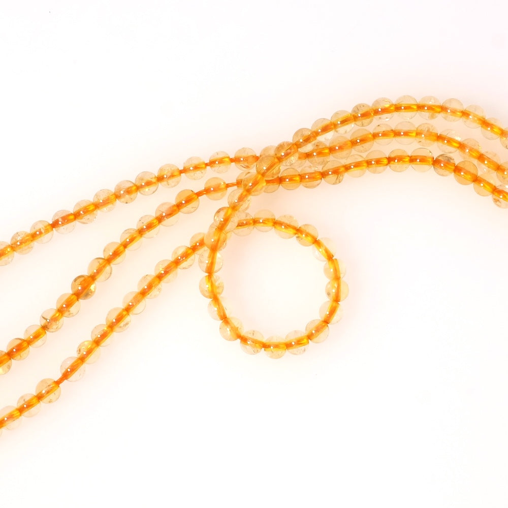 Strand of 4mm round beads in natural Citrine