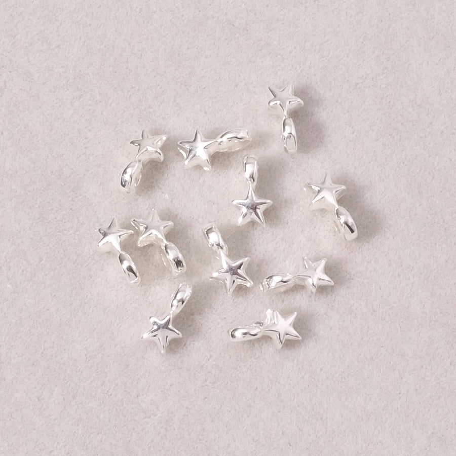 4 star-shaped slider beads in silver Zamak