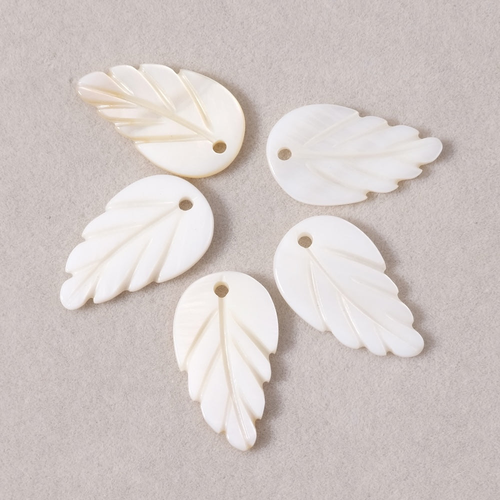 2 White mother-of-pearl leaf pendants