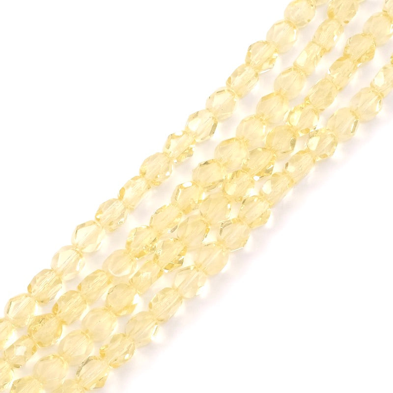 Strand of round flattened faceted Bohemian beads 6mm transparent yellow
