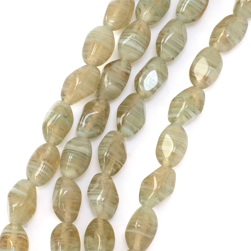 Strand of twisted oval Bohemian glass beads, 11x7mm, transparent taupe