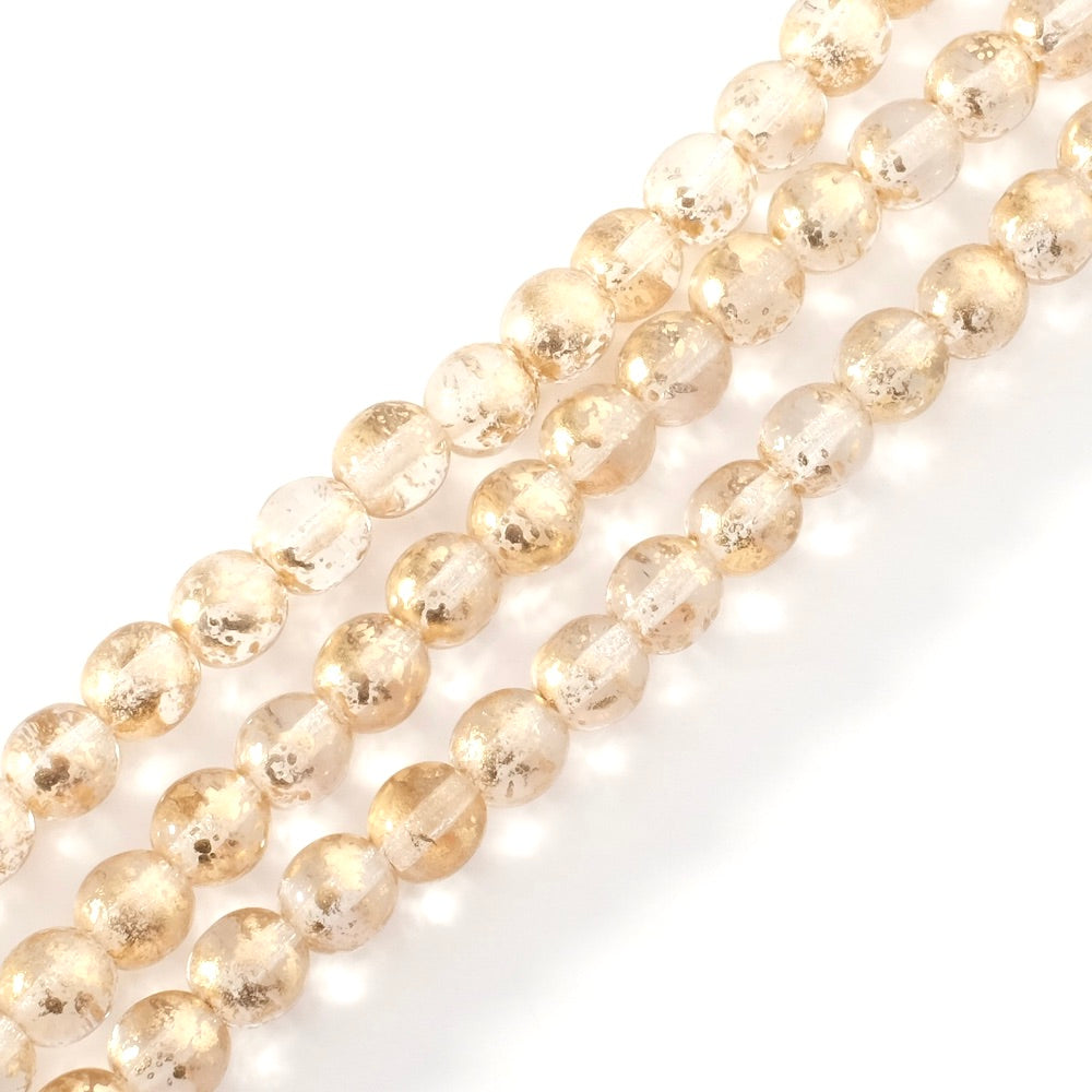 Strand of 6mm round transparent Bohemian beads with gold inclusions