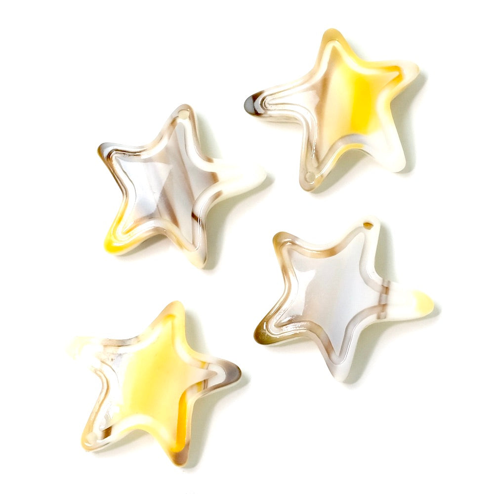 2 beige acetate starfish pendants