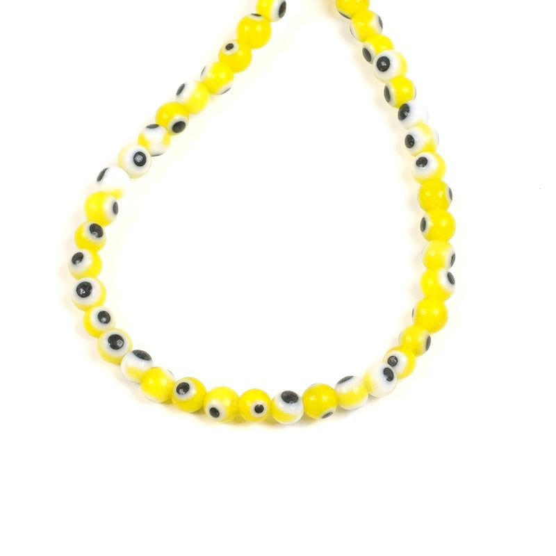 Strand of round glass beads 4mm Yellow Eye