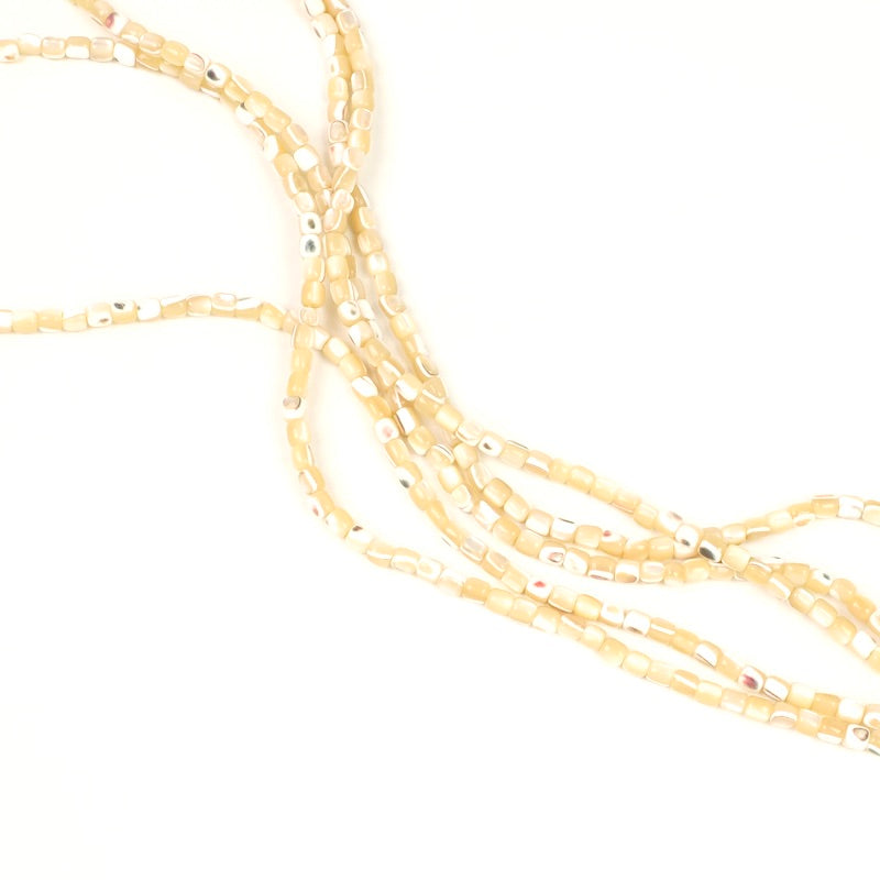 Strand of 130 3mm Mother-of-Pearl sand tube beads