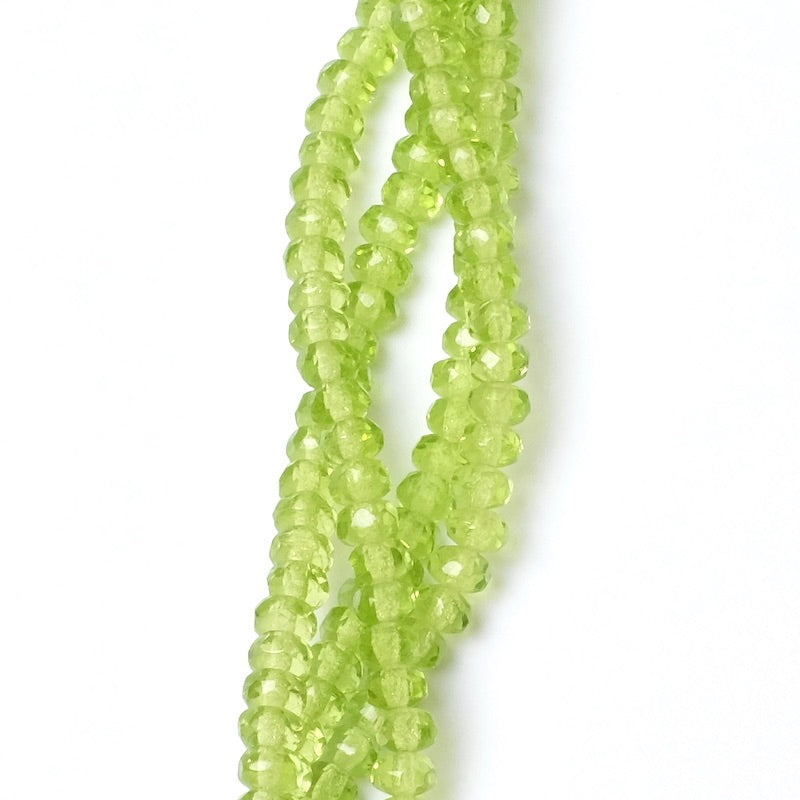 Strand of transparent green faceted Bohemian beads 2x4mm