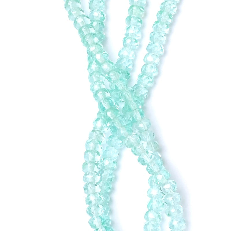 Strand of 2x4mm transparent aqua green faceted Bohemian beads