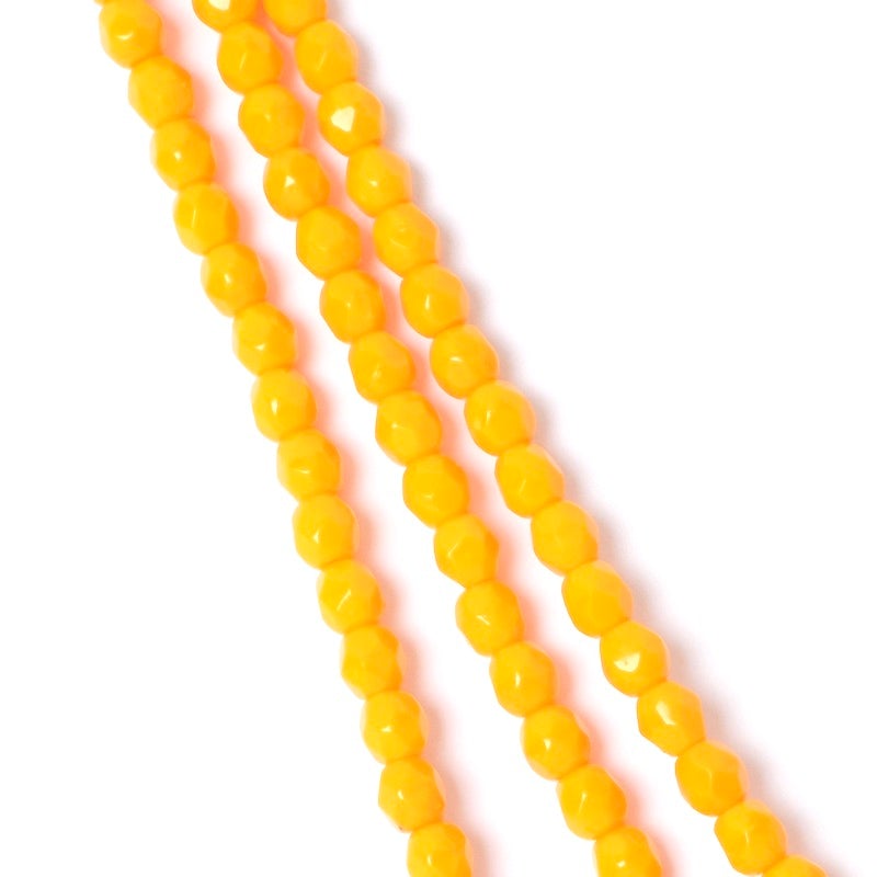 Strand of opaque orange faceted Bohemian round beads 4mm