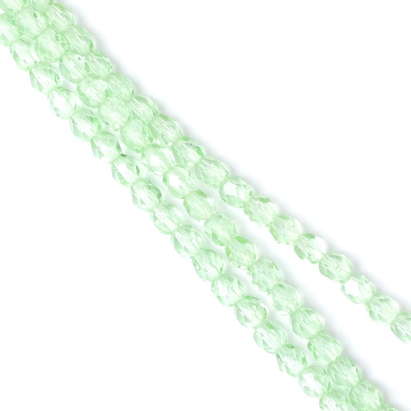 Strand of Bohemian faceted round beads in transparent pastel green, 4mm