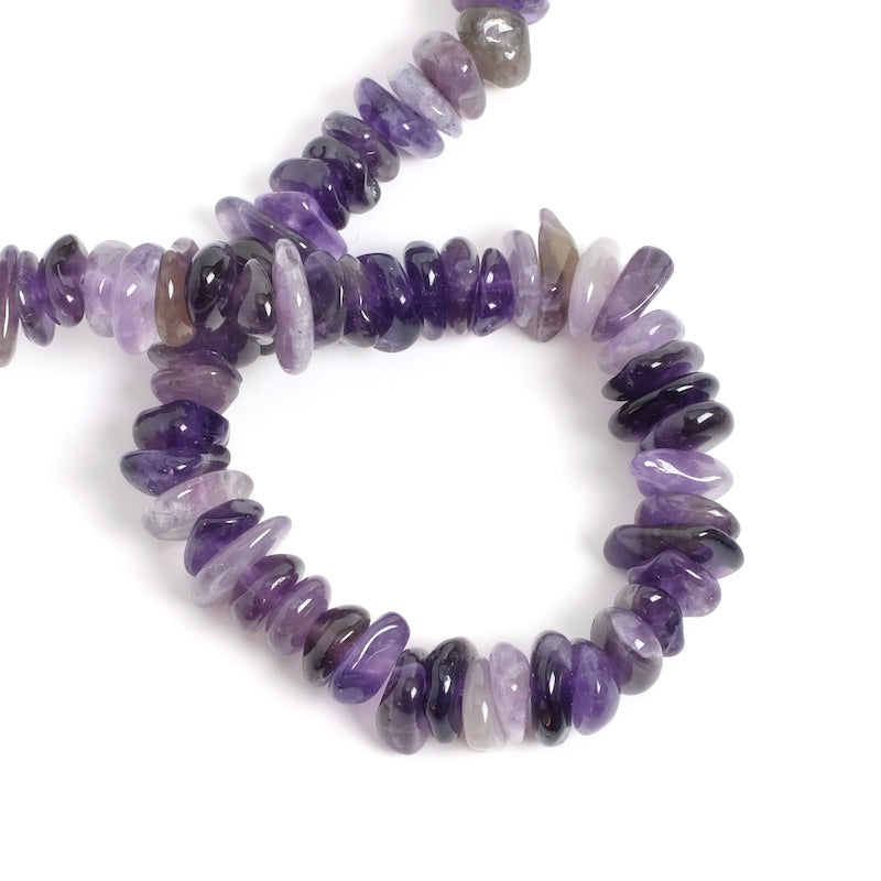 Strand of flat irregular Amethyst beads