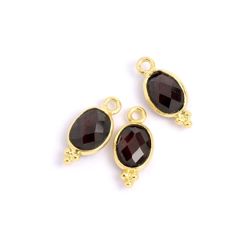 Bohemian oval garnet pendant set in 24K gold-plated brass