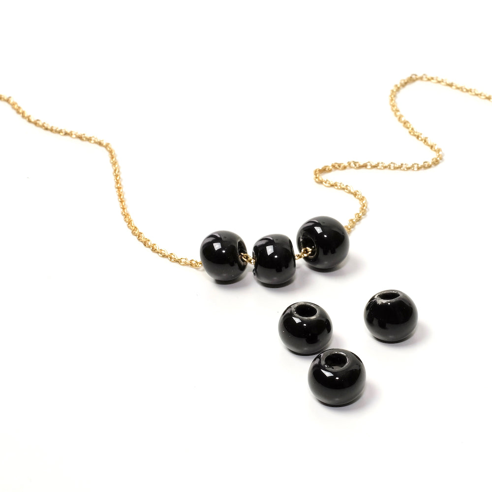 6 Black ceramic round beads