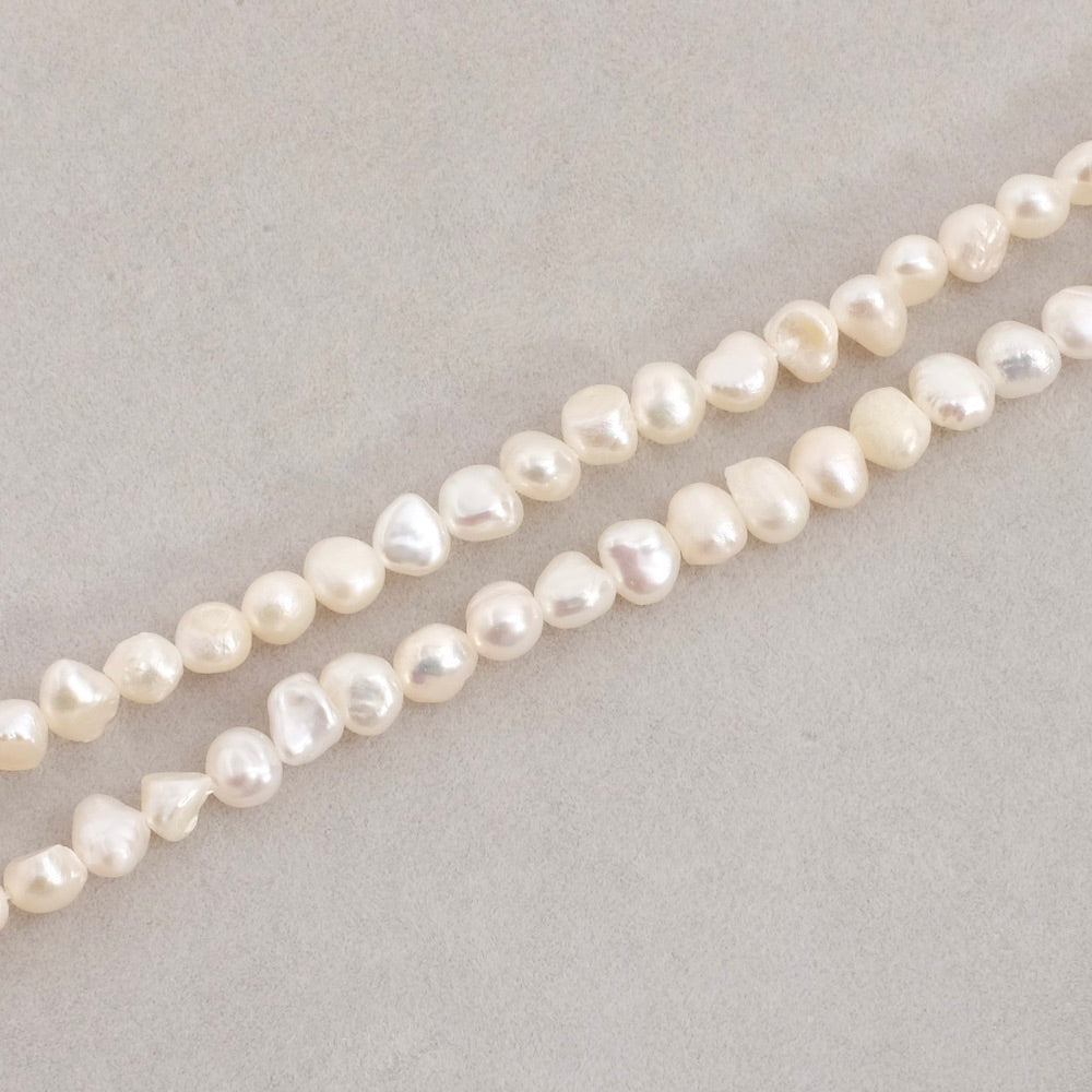 Strand of small irregular 5mm natural mother-of-pearl beads