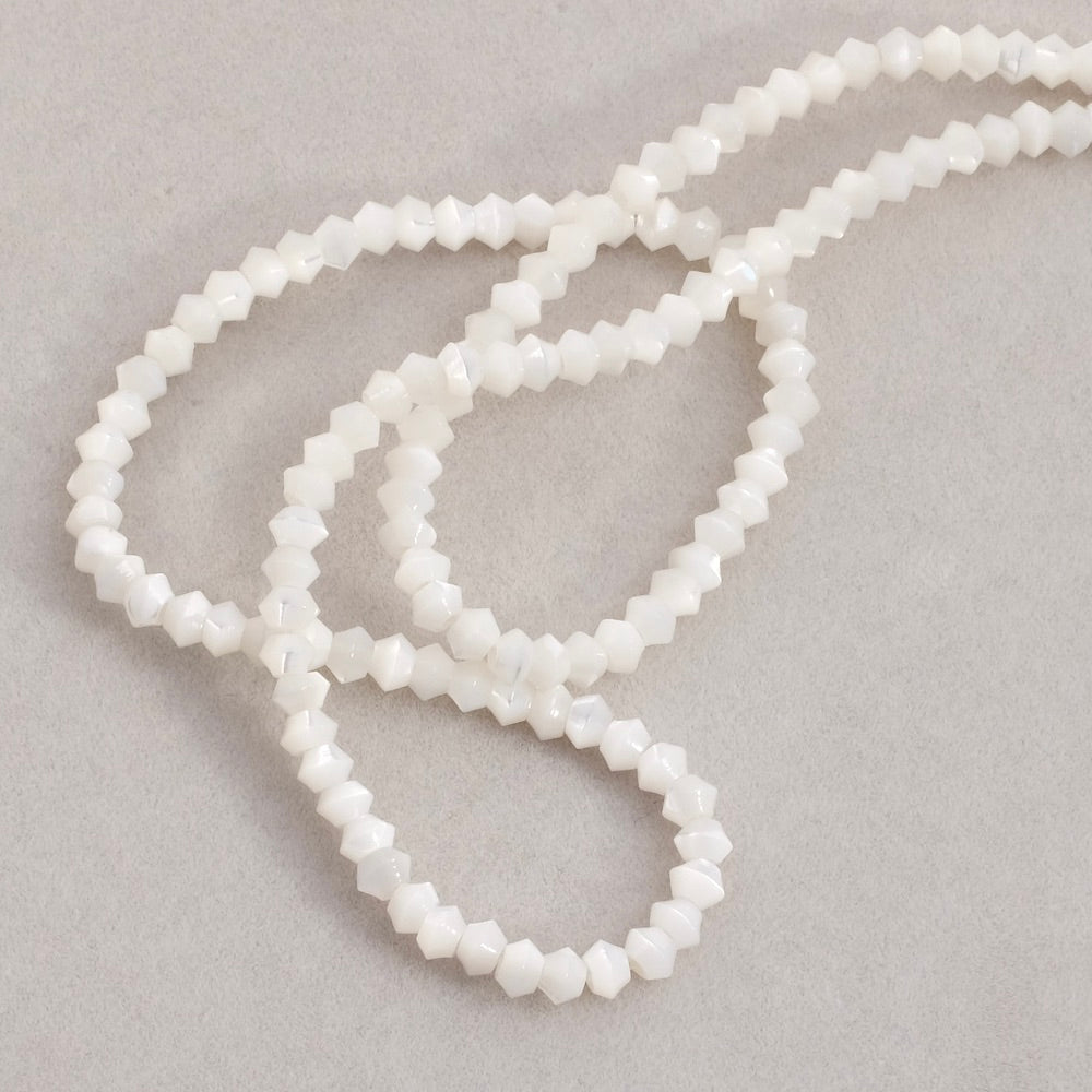 Strand of small irregular Mother-of-Pearl tufted beads