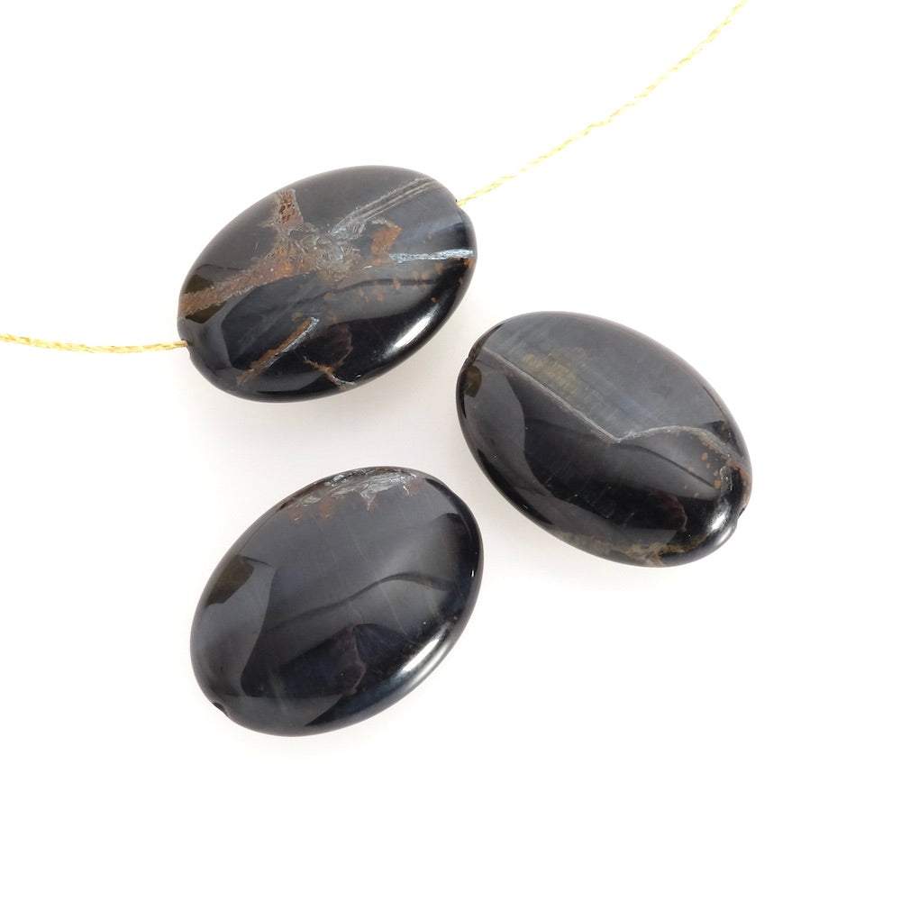Natural oval flattened 18 x 25mm Falcon eye bead à l'unité