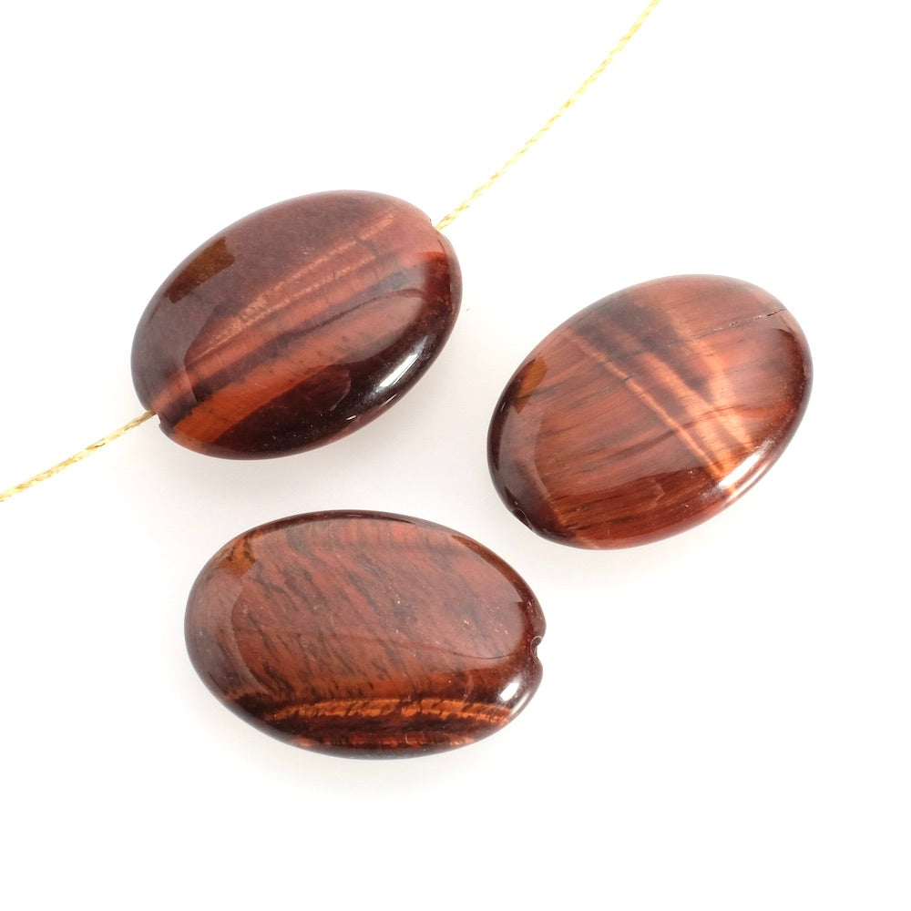 Natural oval flattened 18 x 25mm bull's eye bead à l'unité
